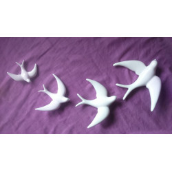 white ceramic swallows. decoration